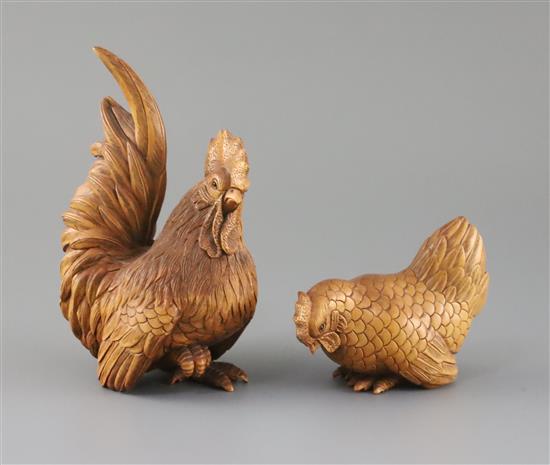 A Chinese boxwood figure of a cockerel and a similar of a hen, late 20th century, H.16cm and 8.5cm